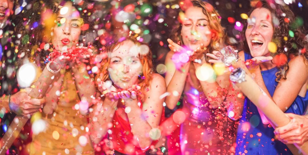 galentines day ideas, girlfriends throwing confetti