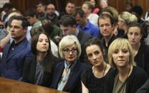The family members of Oscar Pistorius sit in court ahead of his trial at the North Gauteng High Court in Pretoria March 3, 2014. "Blade Runner" Pistorius arrived at the Pretoria High Court on Monday for the start of his murder trial, opening a decisive chapter in the story of the rise and fall of one of the world's best-known athletes.REUTERS/Themba Hadebe/Pool (SOUTH AFRICA - Tags: SPORT ATHLETICS CRIME LAW)