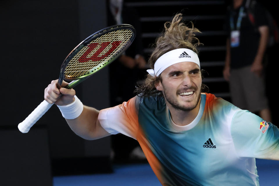 Stefanos Tsitsipas of Greece celebrates after defeating Benoit Paire of France in their third round match at the Australian Open tennis championships in Melbourne, Australia, Saturday, Jan. 22, 2022. (AP Photo/Hamish Blair)