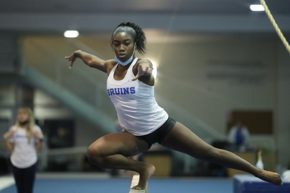 UCLA freshman gymnast Chae Campbell takes part in a team practice session.