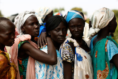 Women wait in line during a UNICEF supported mobile health clinic in the village of Rubkuai, Unity State, South Sudan. REUTERS/Siegfried Modola