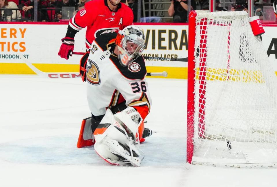 Jan 11, 2024; Raleigh, North Carolina, USA; Anaheim Ducks goaltender John Gibson (36) watches Carolina Hurricanes right wing Andrei Svechnikov (37) (not shown) goal during the first period at PNC Arena. Mandatory Credit: James Guillory-USA TODAY Sports