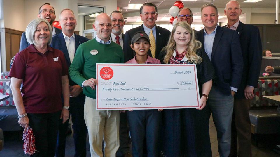 West Texas A&M University officials joined others to congratulate Fam Tial for receiving a $25,000 True Inspiration Scholarship. Pictured are, back from left, Joshua Raef, owner and operator; Texas Rep. Four Price; Dr. Gary Bigham, dean of WT's Terry B. Rogers College of Education and Social Sciences; WT President Walter V. Wendler; Dr. De'Arno De'Armond, associate dean of WT Graduate School and Research; Mike Knox, WT vice president for enrollment management; Dr. Todd Rasberry, WT vice president for philanthropy and external relations; and, front from left, Dr. Betty Coneway, head of WT's Department of Education; Andrew Cathy, CEO of Chick-fil-A; Fam Tial; and Carrie Gregory of Chick-fil-A.