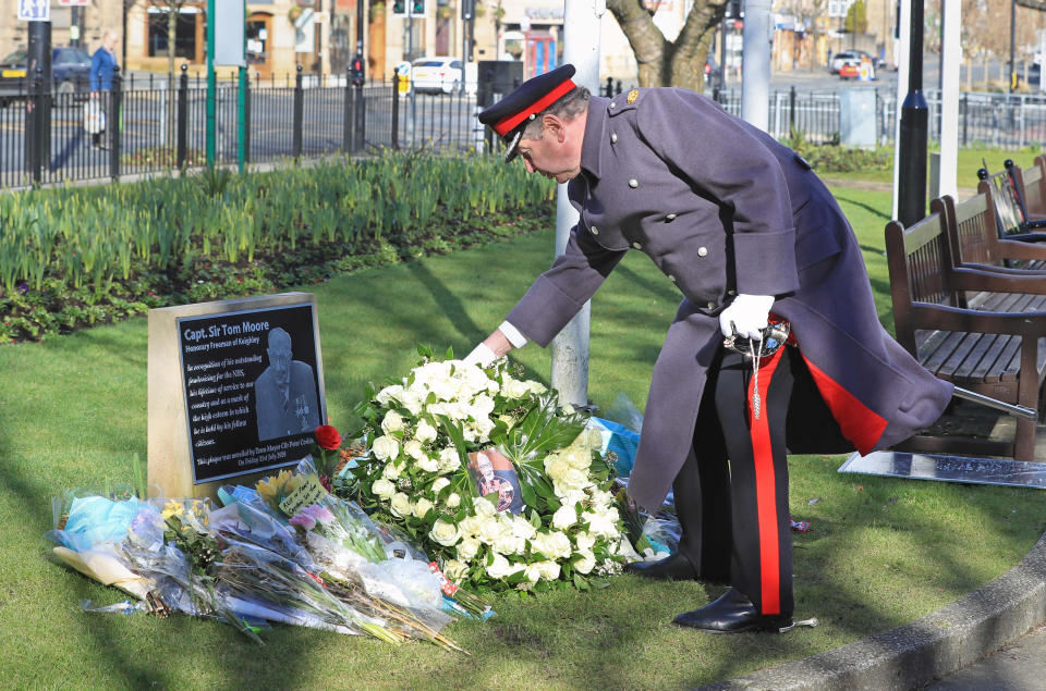 David Pearson, Deputy Lieutenant for West Yorkshire lays a wreath of 200 white roses at the Sir Tom Moore memorial plaque in Keighley, West Yorkshire, on the day of Captain Sir Tom Moore's funeral. Picture date: Saturday February 27, 2021. (Photo by Danny Lawson/PA Images via Getty Images)