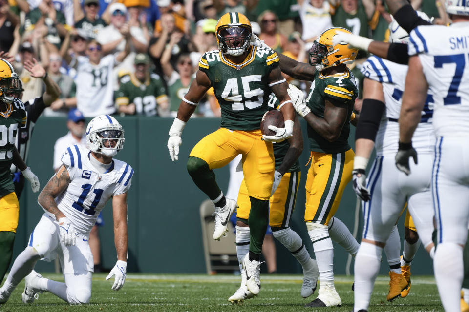 Green Bay Packers linebacker Eric Wilson (45) reacts after intercepting a pass as Indianapolis Colts wide receiver Michael Pittman Jr. (11) looks on during the second half of an NFL football game Sunday, Sept. 15, 2024, in Green Bay, Wis. (AP Photo/Morry Gash)