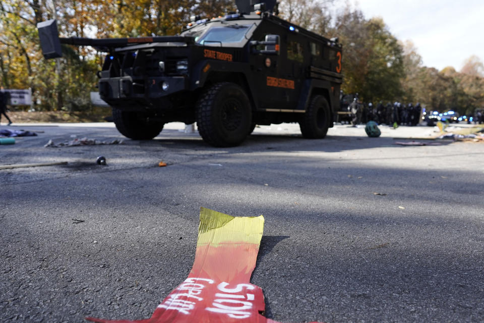 Signage is seen on the pavement after protesters clashed with police during a demonstration in opposition to a new police training center, Monday, Nov. 13, 2023, in Atlanta. (AP Photo/Mike Stewart)