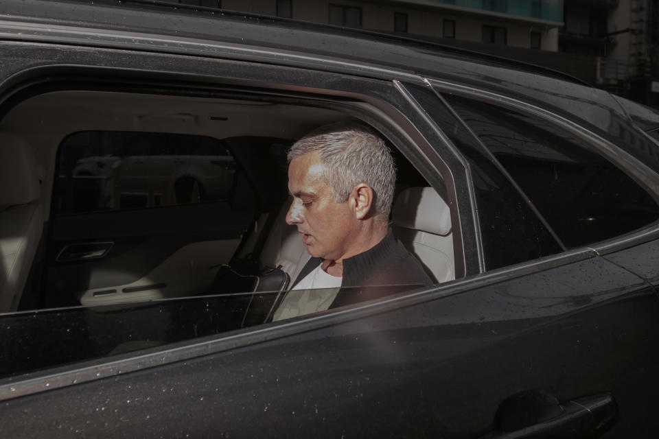 Manchester United former manager Jose Mourinho leaves the Lowry Hotel in Manchester, England, Tuesday, Dec. 18, 2018. Jose Mourinho was fired by Manchester United on Tuesday after failing to restore its status as a major European force in a turbulent 2½-year spell marked by clashes with players and increasing disgruntlement at the team's style of play. (AP Photo/Jon Super)