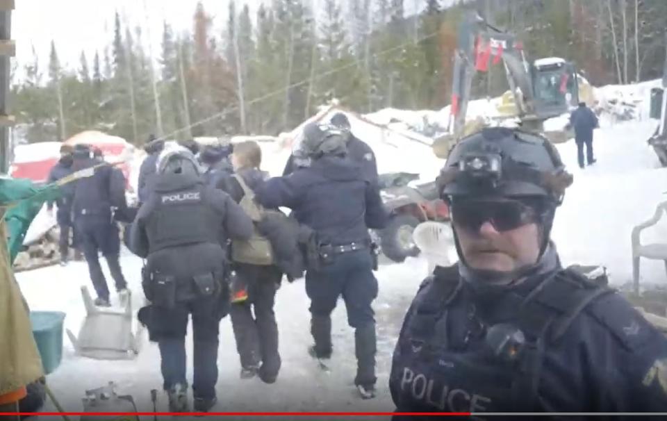 RCMP tactical teams arrest people blockading Coastal GasLink's pipeline construction in November, 2021. 