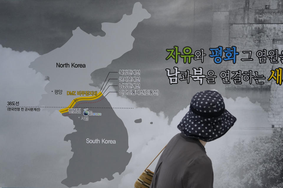 A visitor watches a map of the Korean peninsular at the Imjingak Pavilion in Paju, South Korea, near the border with North Korea, Thursday, July 20, 2023. North Korea wasn't responding Thursday to U.S. attempts to discuss the American soldier who bolted across the heavily armed border and whose prospects for a quick release are unclear at a time of high military tensions and inactive communication channels. The sign reads "Freedom and Peace." (AP Photo/Ahn Young-joon)