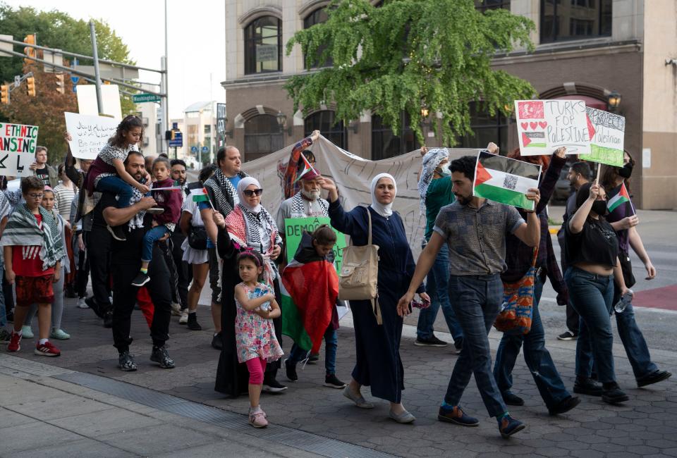 Hundreds of pro-Palestinian supporters march through downtown Indianapolis Thursday, Oct. 12, 2023, as fighting between Israel and Hamas continued for a sixth day in and around Gaza. The latest round of violence that has characterized the region for more than 70 years had claimed more than 2,500 lives on both sides as of the start of the demonstration.