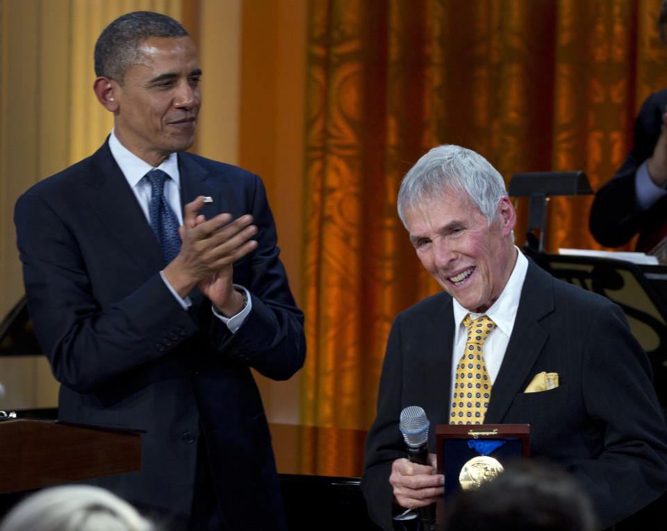 FILE - President Barack Obama applauds after presenting songwriter Burt Bacharach with a 2012 Library of Congress Gershwin Prize for Popular Song in the East Room of the White House on May 9, 2012, in Washington. Bacharach died of natural causes Wednesday, Feb. 8, 2023, at home in Los Angeles, publicist Tina Brausam said Thursday. He was 94. (AP Photo/Carolyn Kaster, File)