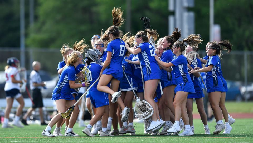 Bronxville players celebrate their win against Cold Spring Harbor in a Class D semifinal at the NYSPHSAA girls lacrosse championships in Cortland on Friday, June 10, 2022.