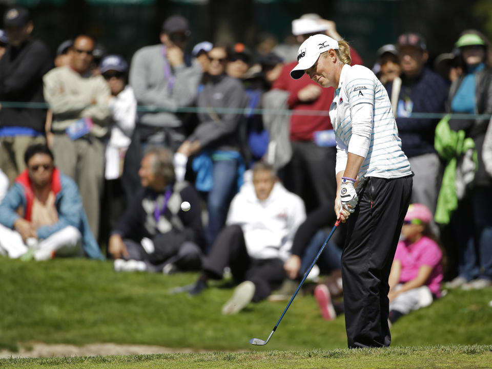 Stacy Lewis hits out of a bunker onto the sixth green of Lake Merced Golf Club during the final round of the Swinging Skirts LPGA Classic golf tournament on Sunday, April 27, 2014, in Daly City, Calif. (AP Photo/Eric Risberg)