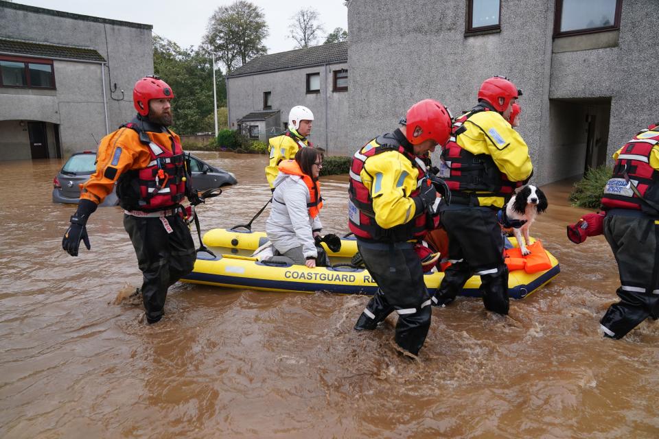 Members of the emergency services help local residents to safety in Brechin, Angus. (Andrew Milligan/PA Wire.) (PA Wire)