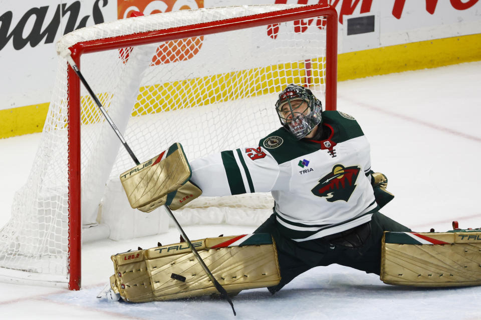 Minnesota Wild goaltender Marc-Andre Fleury (29) sprawls to make a pad-save during the overtime period of an NHL hockey game against the Buffalo Sabres, Saturday, Jan. 7, 2023, in Buffalo, N.Y. (AP Photo/Jeffrey T. Barnes)