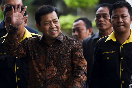 The speaker of Indonesia's parliament Setya Novanto waves as he arrives at Corruption Eradication Commision building (KPK) in Jakarta, Indonesia, July 14, 2017 in this photo taken by Antara Foto. Antara Foto/Hafidz Mubarak via REUTERS