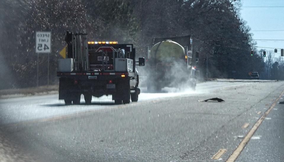 A South Carolina Department of Transportation truck sprays brine solution on SC 81 North near the Interstate 85 entrance, Wednesday, Jan. 8, 2025.