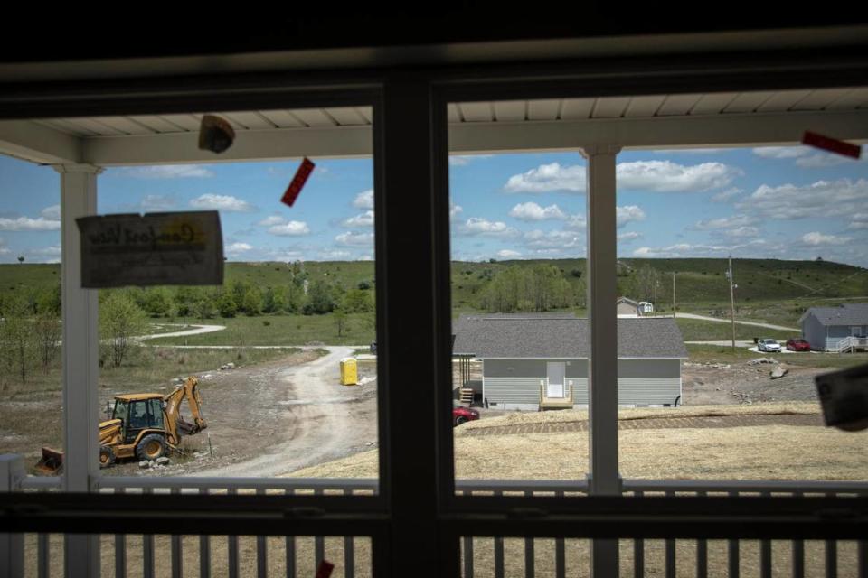 Houses in various stages of construction by nonprofit Housing Development Alliance on Wells Mountain where there used to be a strip mine outside of Hazard, Ky., Tuesday, May 11, 2021. The HDA recently announced a 15-house subdivision to be constructed in Allais, area of Hazard.