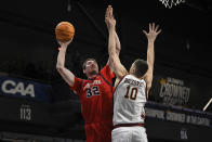 Stony Brook center Keenan Fitzmorris (32) attempts a shot against Charleston forward Ante Brzovic (10) during the first half of an NCAA college basketball game in the championship of the Coastal Athletic Association conference tournament, Tuesday, March 12, 2024, in Washington. (AP Photo/Terrance Williams)