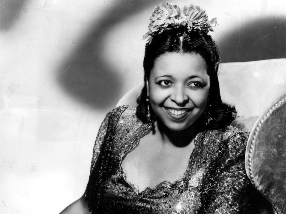 Black and white photo of Ethel Waters in an embellished dress and headpiece.