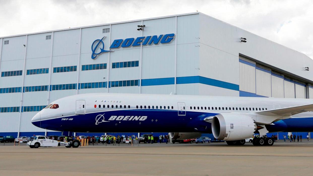 PHOTO: In this March 31, 2017, file photo, Boeing employees stand near the new Boeing 787-10 Dreamliner at the company's facility in South Carolina after conducting its first test flight at Charleston International Airport in North Charleston, S.C.  (Mic Smith/AP, FILE)