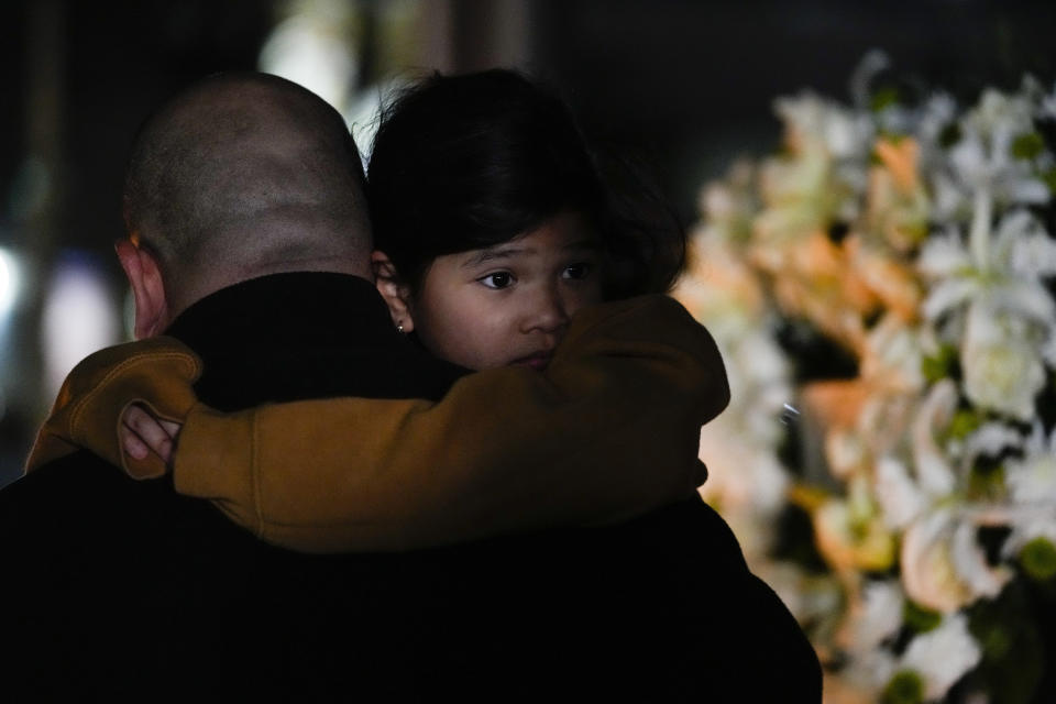 People gather for a vigil honoring the victims of a shooting several days earlier at Star Ballroom Dance Studio, Monday, Jan. 23, 2023, in Monterey Park, Calif. A gunman killed multiple people late Saturday amid Lunar New Year's celebrations in the predominantly Asian American community. (AP Photo/Ashley Landis)