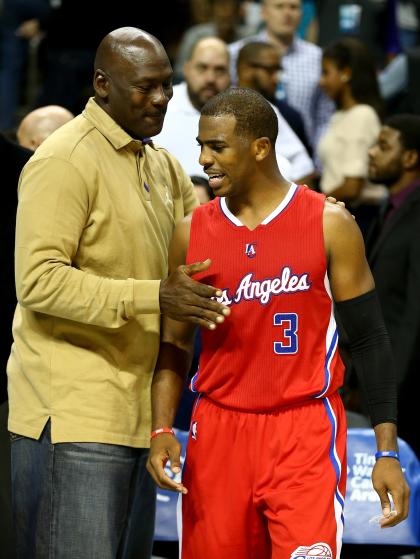 Some random owner talks with Jordan Brand athlete Chris Paul. (Photo by Streeter Lecka/Getty Images)