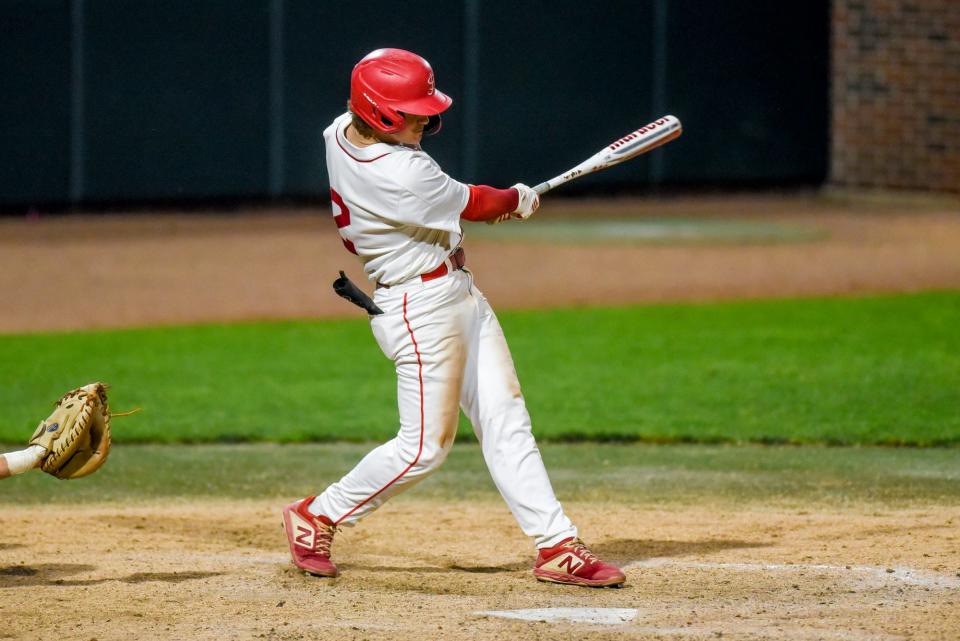 St. Johns' Mark Bendele drives in a run against Grand Ledge during the fourth inning on Wednesday, May 31, 2023, at McLane Stadium on the Michigan State campus in East Lansing.