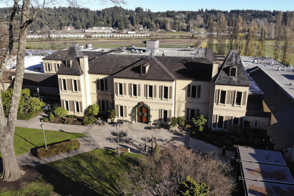 In this photo taken Thursday, Nov. 21, 2019, the French-style inspired main building of the Chateau Ste. Michelle winery is seen in Woodinville, Wash. Washington, which now boasts more than 1,000 wineries in the state, has become a force in the wine industry. Washington is the second-largest producer of premium wines in the United States, trailing only California. (AP Photo/Elaine Thompson)