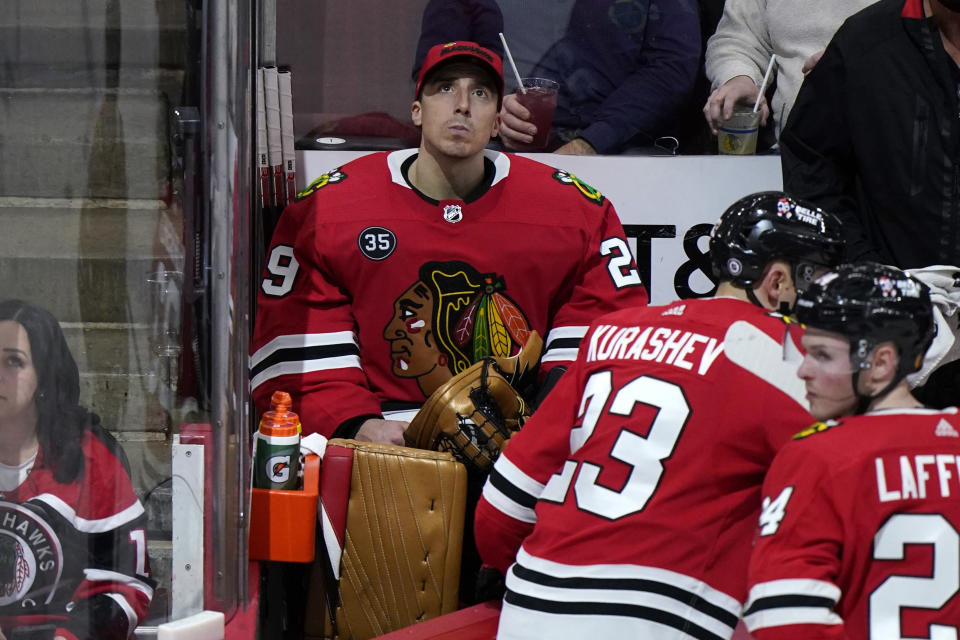 Chicago Blackhawks goaltender Marc-Andre Fleury (29) looks up at the scoreboard from the bench during the third period of the team's NHL hockey game against the Minnesota Wild in Chicago, Friday, Jan. 21, 2022. The Wild won 5-1. (AP Photo/Nam Y. Huh)