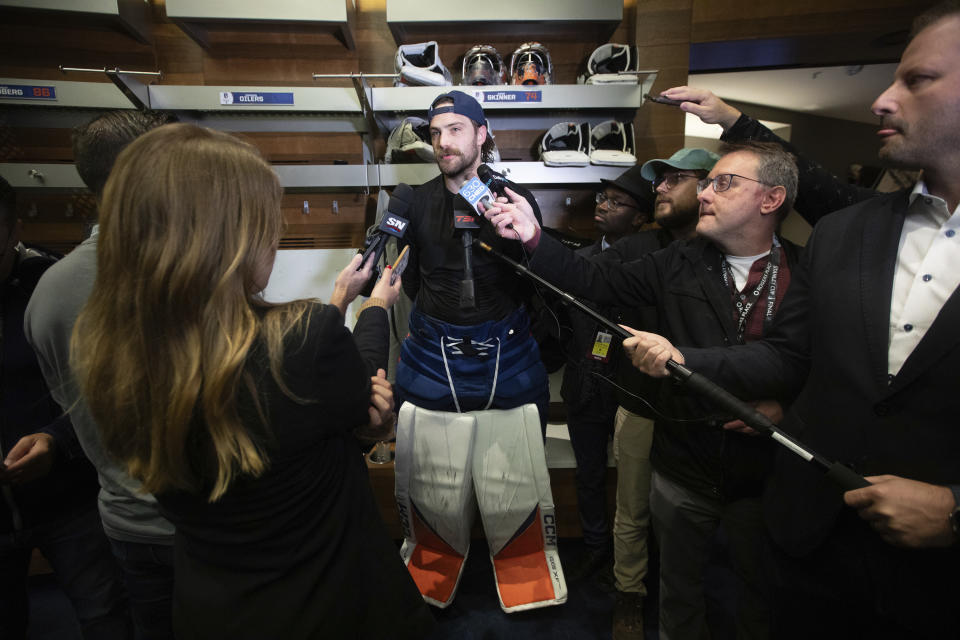 Edmonton Oilers' goalie Stuart Skinner (74) talks to the media after NHL hockey practice, Wednesday June 12, 2024, in Edmonton, Alberta. The Oilers host the Florida Panthers in Game 3 of the Stanley Cup Finals on Thursday. (Jason Franson/The Canadian Press via AP)