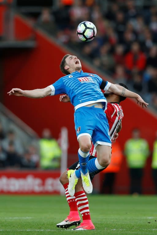 Bournemouth's Dan Gosling fights for the ball with Southampton's Sofiane Boufal (R) during their English Premier League match, at St Mary's Stadium in Southampton, on April 1, 2017