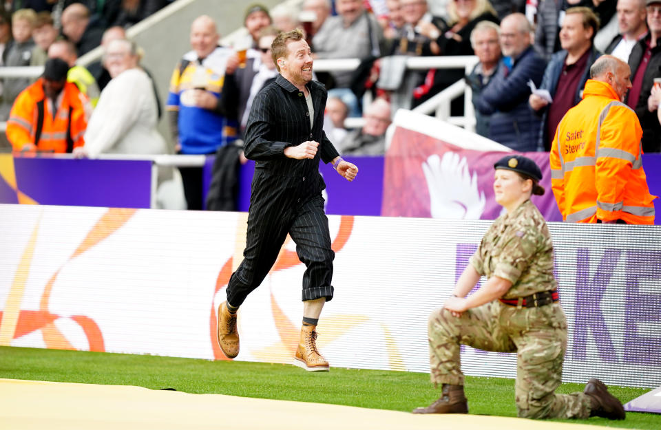 Seen here, Ricky Wilson of The Kaiser Chiefs entertains the crowd after technical issues plague the opening of the Rugby League World Cup in Newcastle. 