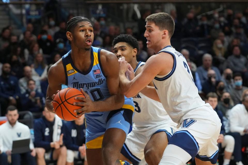 Marquette's Justin Lewis looks to make a move against Villanova's guard Collin Gillespie in the first half on Wednesday.