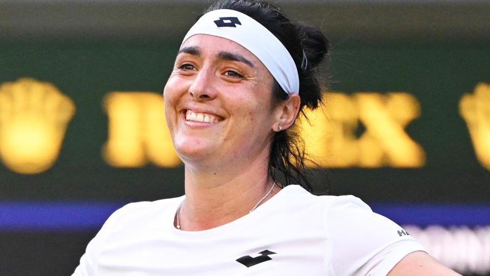 Ons Jabeur smiles to the crowd after her Wimbledon quarter-final win.