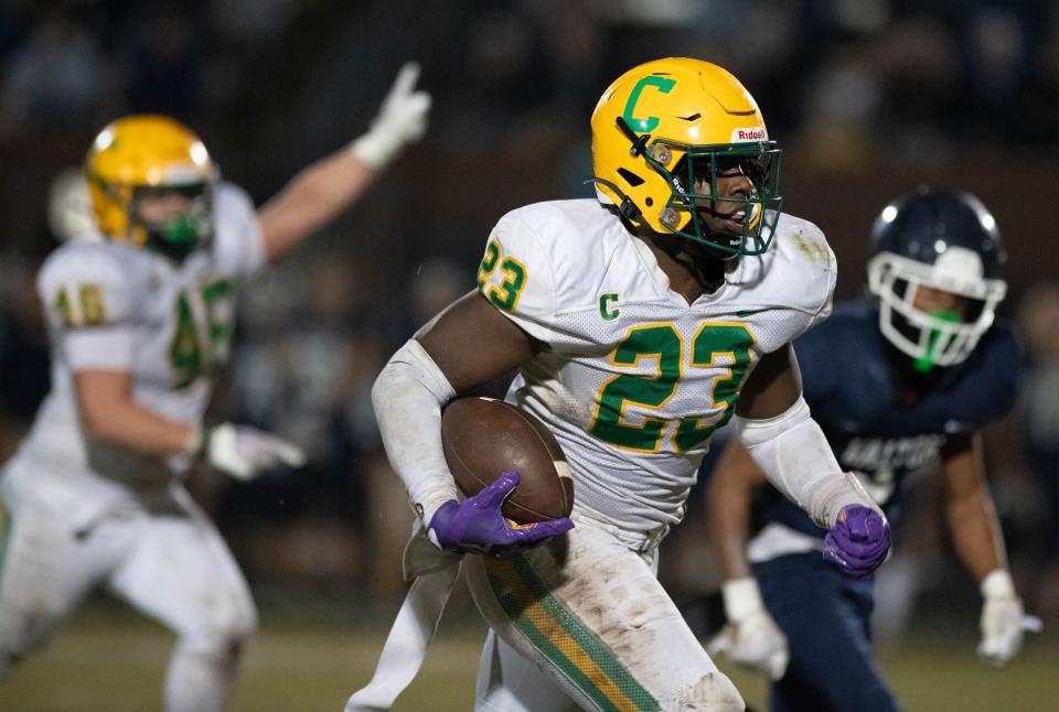 Nigel Nelson (23) rushes for a touchdown and a 34-7 Crusaders lead during the Catholic vs Walton high school playoff football game at Walton HIgh School in DeFuniak Springs on Friday, Nov. 17, 2023.