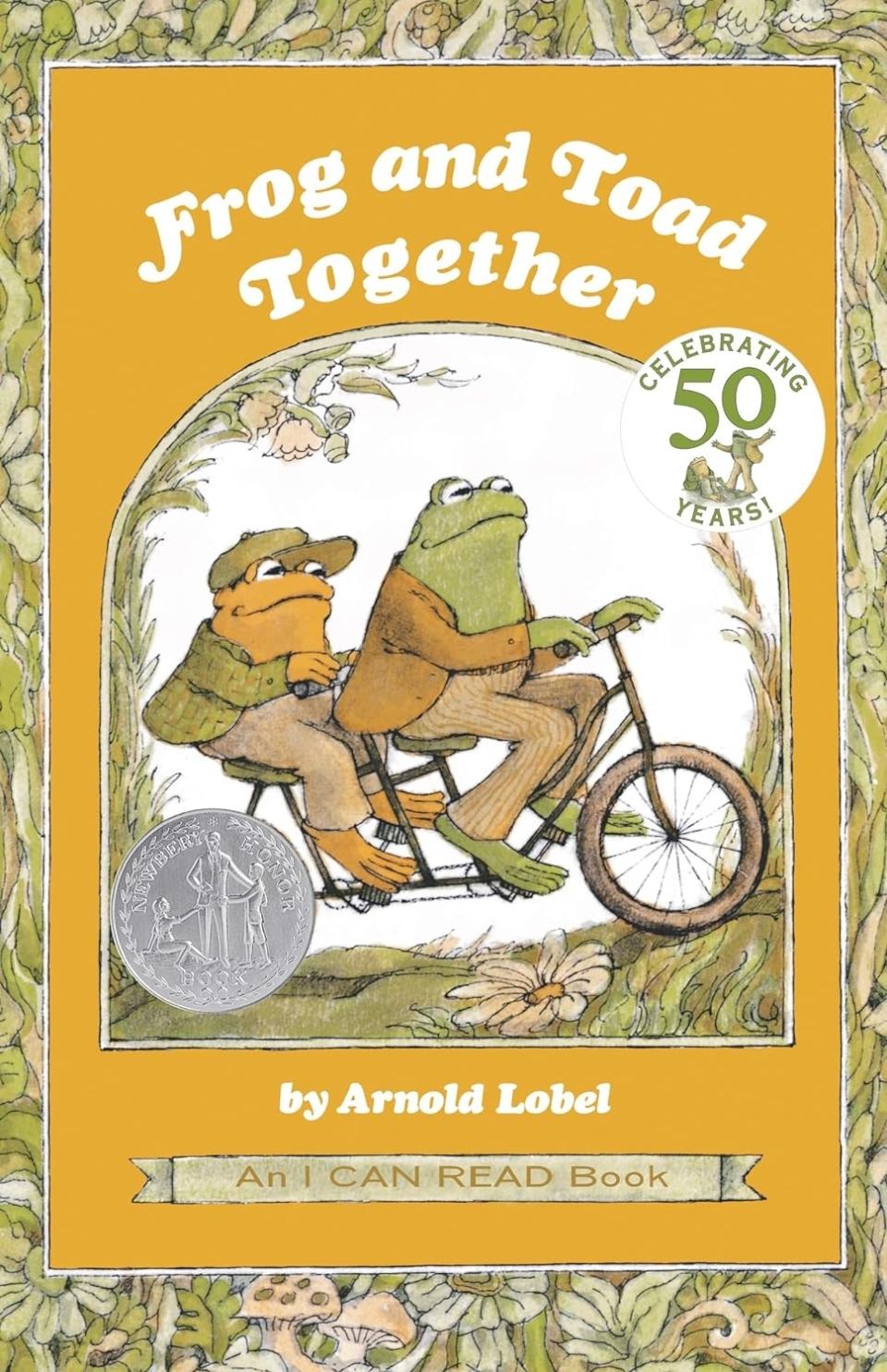 Cover of "Frog and Toad Together" book, showing the characters Frog and Toad on a bicycle, celebrating 50 years