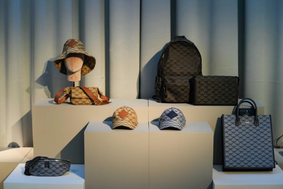 Bags and caps and accessories are displayed at the MCM showroom part of the Spring Summer 2024 collection presented in Milan, Italy, Sunday, June 18, 2023. (AP Photo/Luca Bruno)