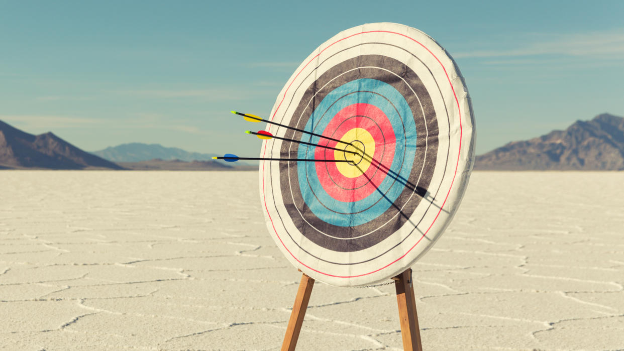 A target with several arrows in the bullseye stands on the Bonneville Salt Flats.