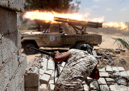 Libyan forces allied with the U.N.-backed government fire weapons during a battle with IS fighters in Sirte, Libya, July 21, 2016. REUTERS/Goran Tomasevic/File Photo