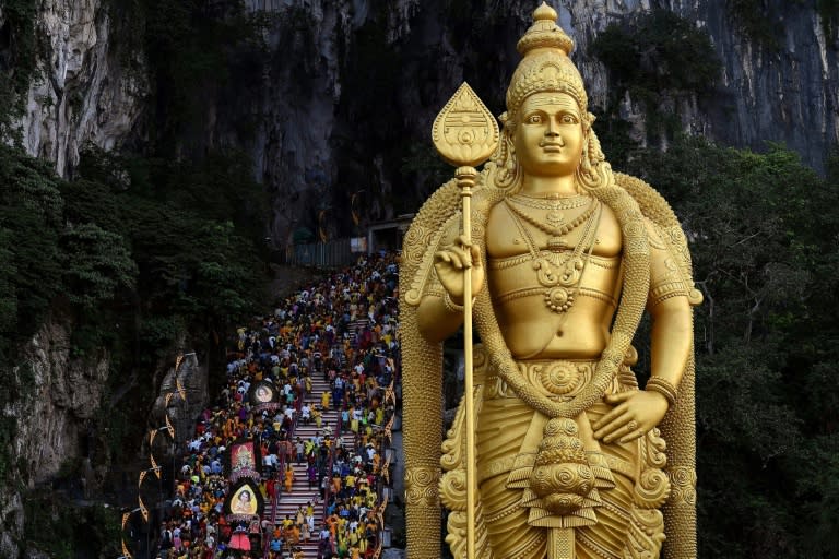 Malaysian Hindu devotees walk up the 272 stairs to the Batu Caves temple during the Thaipusam festival celebrations in Kuala Lumpur