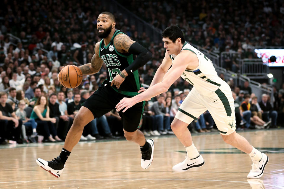 MILWAUKEE, WISCONSIN - APRIL 28:  Marcus Morris #13 of the Boston Celtics dribbles the ball while being guarded by Ersan Ilyasova #77 of the Milwaukee Bucks in the first quarter during Game One of Round Two of the 2019 NBA Playoffs at the Fiserv Forum on April 28, 2019 in Milwaukee, Wisconsin. NOTE TO USER: User expressly acknowledges and agrees that, by downloading and or using this photograph, User is consenting to the terms and conditions of the Getty Images License Agreement. (Photo by Dylan Buell/Getty Images)