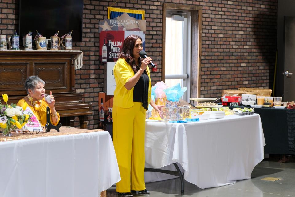 Yolanda Mendoza addresses the audience at AM de Amarillo's Mujeres de Amarillo (women in yellow) event last weekend in east Amarillo.