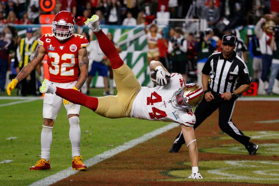San Francisco 49ers' Kyle Juszczyk (44) falls into the end zone for a touchdown against the Kansas City Chiefs during Super Bowl 54 on Feb. 2, 2020, in Miami Gardens, Fla.