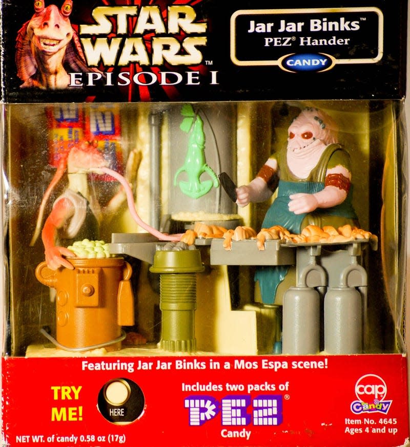 Image: <a class="link " href="https://www.propertyroom.com/l/collectible-1999-star-wars-jar-jar-binks-in-mos-espa-scene-pez-hander/10183343" rel="nofollow noopener" target="_blank" data-ylk="slk:Property Room;elm:context_link;itc:0;sec:content-canvas">Property Room</a>