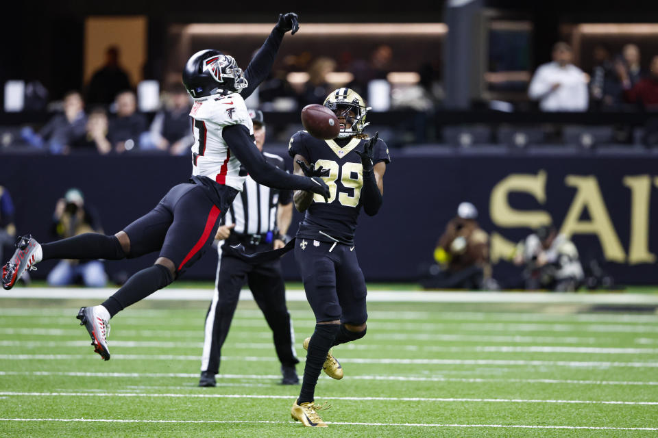 New Orleans Saints wide receiver Rashid Shaheed (89) makes a catch over Atlanta Falcons safety Richie Grant (27) on his way to a touchdown in the first half of an NFL football game in New Orleans, Sunday, Dec. 18, 2022. (AP Photo/Butch Dill)