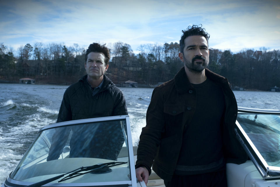 Ozark. (L to R) Jason Bateman as Martin 'Marty' Byrde, Alfonso Herrera as Javi in episode 401 of Ozark. Cr. Steve Dietl/Netflix Â© 2021