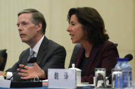 U.S. Commerce Secretary Gina Raimondo, right, speaks next to U.S. Ambassador to China Nick Burns during a meeting with Chinese Minister of Commerce Wang Wentao at the Ministry of Commerce in Beijing, Monday, Aug. 28, 2023. (AP Photo/Andy Wong, Pool)