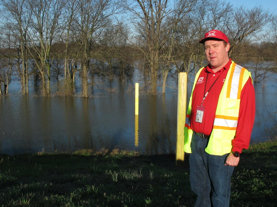 Lance Engle, a dredging project manager with the U.S. Army Corps of Engineers, speaks with a reporter about flooding protection along the Ensley levee near the Mississippi River in Memphis, Tenn., on Thursday, March 21, 2019. (AP Photo/Adrian Sainz)