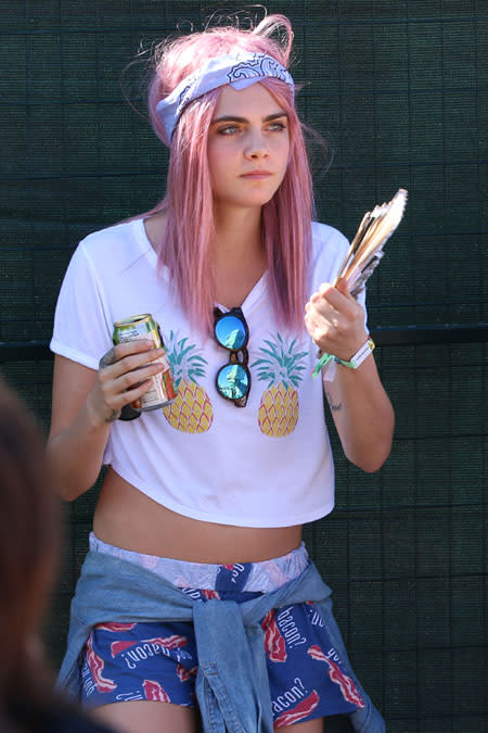 Cara Delevingne looked awesome rocking a new pink 'do when she came out to support her girlfriend, singer St. Vincent, at the Osheaga festival in Montreal. The bright-pink manic pixie dream girl look was strikingly different from Cara's recent styles, but the <em>Paper Towns</em> actress really pulled off the fun color choice. Splash News <strong>NEWS: 19 Times Cara Delevingne Was the Most Relatable World-Famous Supermodel Ever </strong> It's possible she's just rocking a semi-faded pink wig, but even so the color is a good choice. The 22-year-old model and actress first opened up about her relationship with St. Vincent -- whose real name is Annie Clark -- during an interview with <em> Vogue</em> for their July issue. <strong>WATCH: Cara Delevingne Declares Her Love for Girlfriend St. Vincent </strong> "I think that being in love with my girlfriend is a big part of why I'm feeling so happy with who I am these days," she said of the 32-year-old singer. For more on the cute couple, check out the video below.